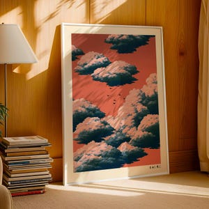 May include: A framed vertical art print featuring a sky with a reddish-orange background filled with dark blue, fluffy clouds and a small flock of birds flying in the centre. The bottom right corner contains the Japanese text 自由に飛ぶよ.