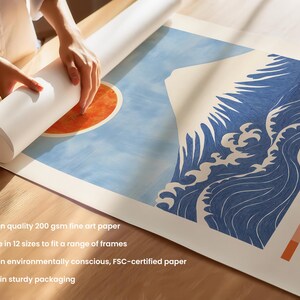 Close-up of Mount Fuji print being rolled for packaging, showing fine art paper texture, vivid red sun, and traditional Japanese wave design. High-quality Japanese poster printed on FSC-certified paper, ideal for framing.