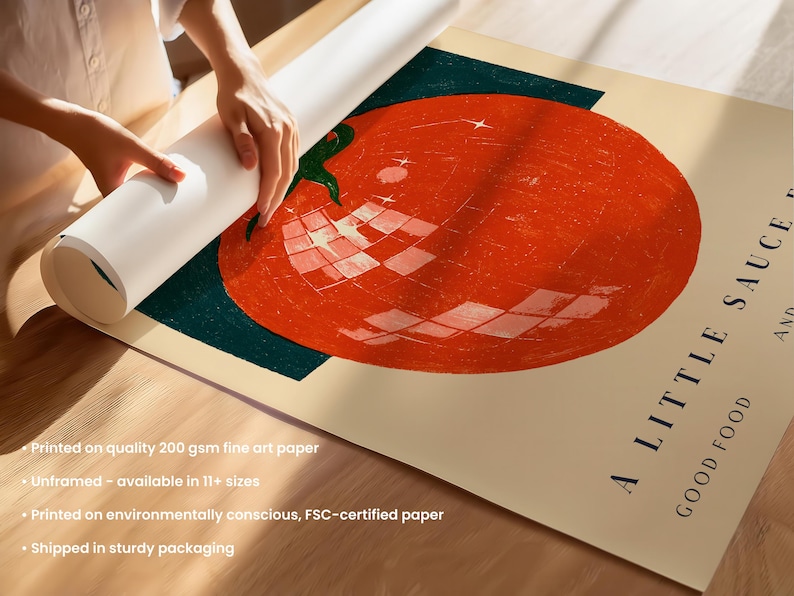 A person is rolling up a roll of 200 gram fine art paper, which is available in 11+ sizes. The paper is printed on environmentally conscious, FSC-certified paper, and it is shipped in sturdy packaging.