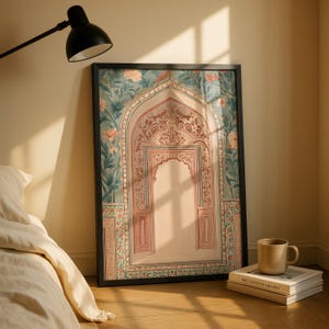 May include: Framed art print featuring an ornate archway design in soft pinks, greens, and creams. The artwork has floral and geometric patterns, with a detailed, textured appearance. The print is displayed in a black frame, leaning against a wall.