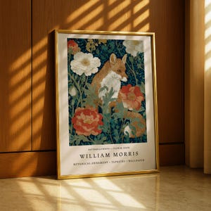 A framed poster of William Morris' botanical ornament, featuring a fox surrounded by flowers and foliage.