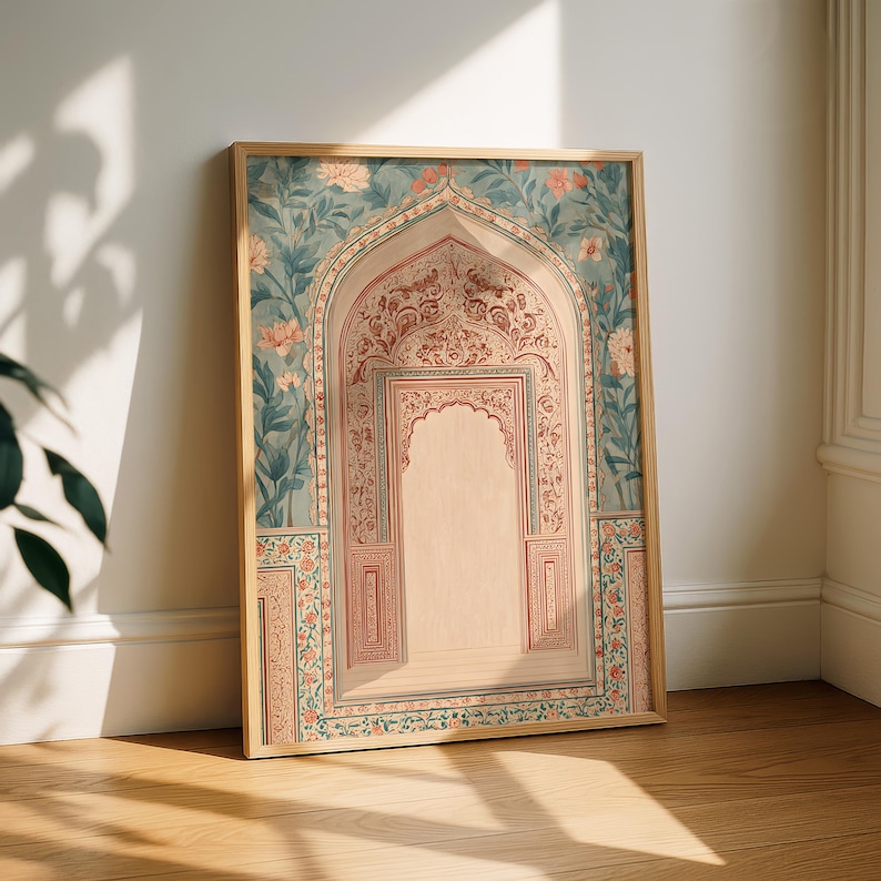 May include: A framed art print featuring an ornate archway design. The artwork showcases a detailed illustration with floral and geometric patterns in shades of teal, peach, and beige. The wooden frame complements the artwork's aesthetic.