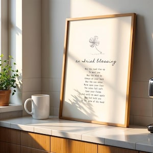Irish Blessing poem framed and displayed beside coffee mug in sunlit kitchen – uplifting Celtic quote wall decor.