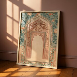 May include: Framed art print featuring an ornate archway design. The artwork showcases a detailed interior with intricate patterns in red and cream, set against a backdrop of teal and floral motifs. The frame is a light beige, and the print is leaning against a wall.
