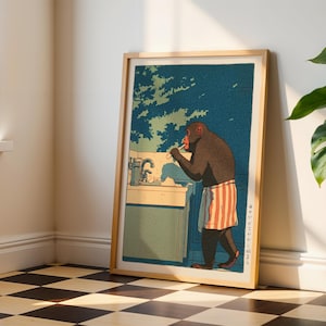 May include: A framed print featuring a monkey brushing its teeth in a bathroom setting. The artwork has a blue and green background with a monkey wearing a red and white striped towel. The frame is made of light-colored wood.
