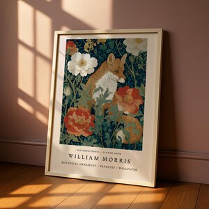 A framed print of a painting titled "William Morris" depicting a fox surrounded by flowers and foliage.