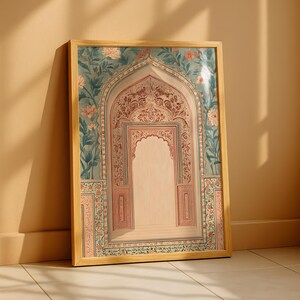 May include: A framed print featuring an ornate archway design. The artwork showcases a detailed, symmetrical composition with floral and geometric patterns in shades of teal, coral, and beige. The wooden frame adds a natural touch to the decorative piece.
