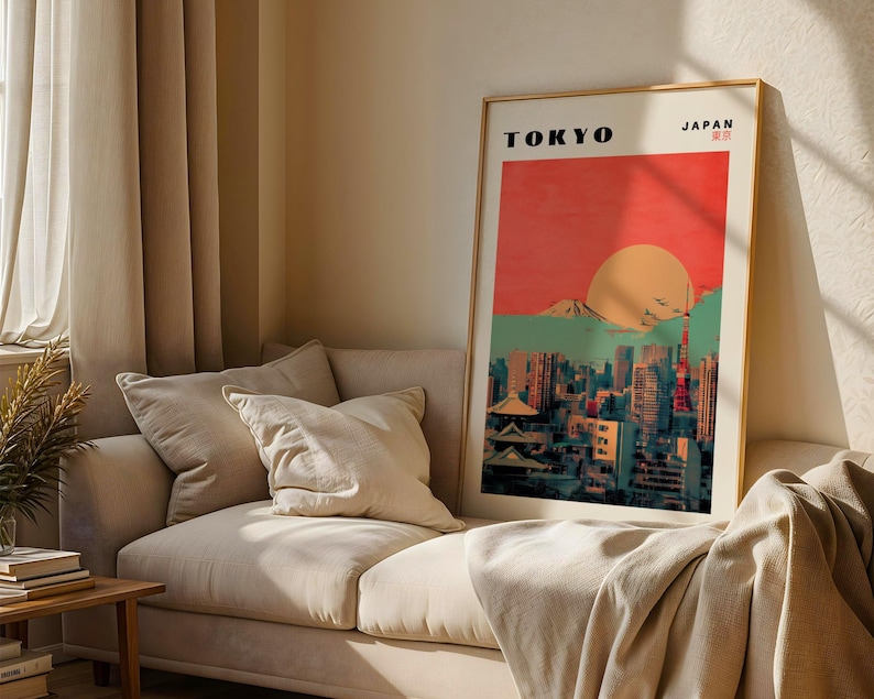 May include: A vintage-style poster with a red, orange, and green color scheme depicting a cityscape with skyscrapers and a mountain in the background. The text "TOKYO" and "JAPAN" is printed in black at the top of the poster.