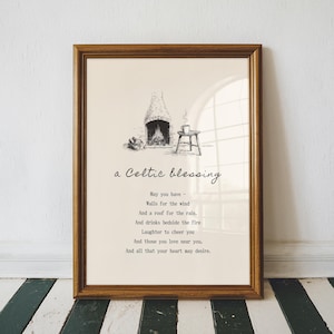 May include: A framed print with a brown wooden frame. The artwork features a black and white illustration of a fireplace with a small table and a cup. The text reads "a Celtic blessing" and a poem about blessings.