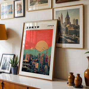 May include: A vintage-style poster with a red, orange, and blue color scheme depicting a cityscape with the text "TOKYO" and "JAPAN" in black lettering.