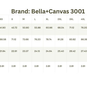 May include: Size chart for Bella+Canvas 3001 apparel, displaying width, length, and sleeve length measurements in centimeters for sizes XS to 5XL. The chart also includes a size tolerance of 3.81 cm.
