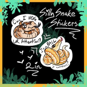 May include: Two stickers with cartoon snakes. One sticker says "Can I HOG UR Attention?" and features a brown snake. The other says "I'm a BALL of sunshine!" and shows a yellow and brown snake. The stickers are labeled "Silly Snake Stickers".