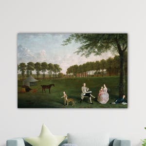 May include: A framed print of a pastoral scene featuring a family and a dog in a grassy field. A man sits writing, a woman and child sit nearby, and a boy plays with a dog. A horse and tent are in the background.