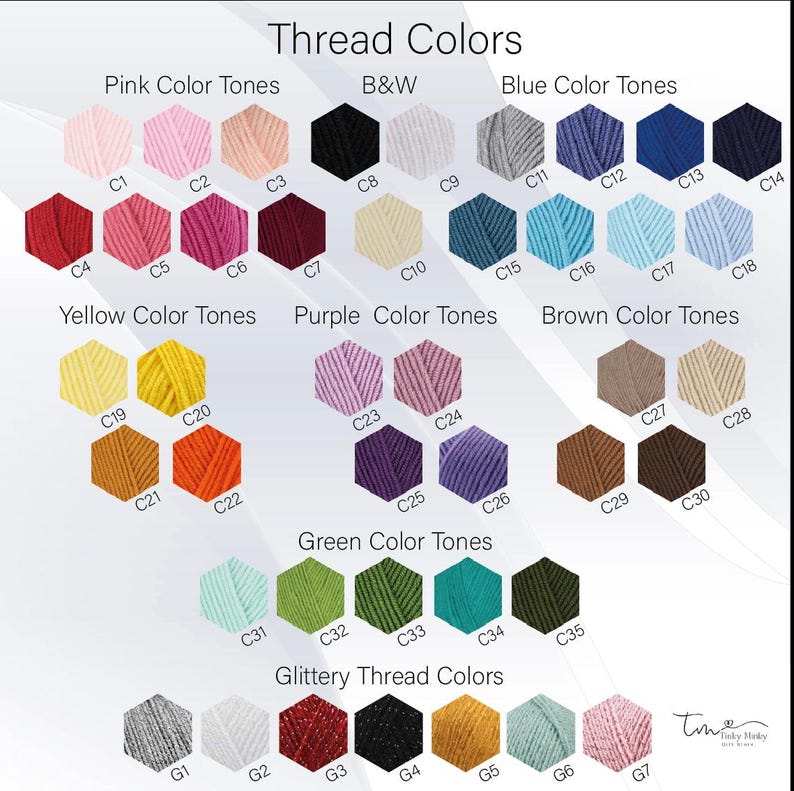 May include: A chart of thread colors organized by color family. The chart includes pink, black and white, blue, yellow, purple, brown, green, and glittery thread colors. Each color is labeled with a number.