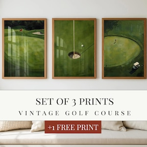 May include: A set of three framed wall art prints featuring green golf course landscapes. The left print shows a flag on a green, the centre shows a golf ball near a hole, and the right shows a golf cart on a green. Text reads LUMISTUDIO.CO.