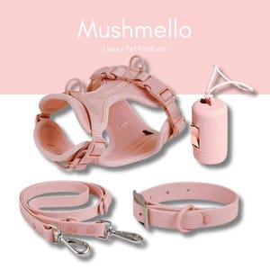 May include: A pink dog harness, lead, collar, and poop bag holder set. The set is made of soft, comfortable material and is designed for everyday use. Mushmello Luxury Pet Products.