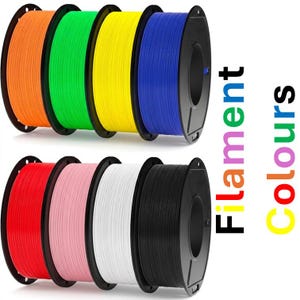 May include: Eight circular spools of 3D printer filament arranged in two rows of four. The colors include orange, green, yellow, blue, red, pink, white, and black. The text "Filament Colours" is printed vertically on the right side in rainbow colors.