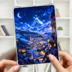 May include: A clear tablet case featuring a vibrant, detailed illustration of a fantasy city nestled in a mountain valley under a starry night sky with a crescent moon. The text Wildflower&Pages is printed in the center of the image.