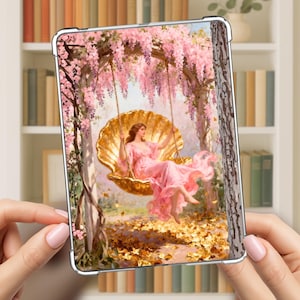May include: A clear tablet case featuring a painting of a woman in a pink dress on a seashell swing. The swing is suspended from a wisteria-covered arch. The background includes a bookshelf.