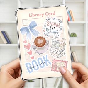 May include: A clear tablet case with a decorative design featuring a "Library Card" theme. The design includes a blue bow, hearts, coffee, books, and the text "SHHHH I'M READING" and "BOOK lover".