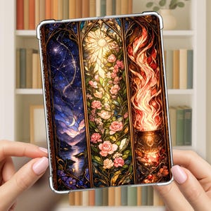 May include: A rectangular tablet case featuring a three-panel stained glass design. The left panel shows a night sky with a crescent moon and stars over water. The center panel displays pink roses and foliage. The right panel depicts orange flames.
