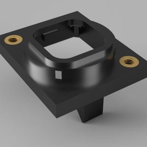 May include: A black plastic square-shaped mounting plate with a recessed square opening and two gold screws.