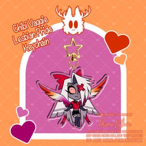 May include: An acrylic keychain featuring a chibi character with white hair, a red bow, and wings colored in shades of pink, orange, and white. The character wears a red shirt and black shorts. It includes a gold star-shaped clasp and text.