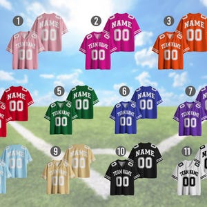 May include: A collection of eleven football jerseys in various colors, including pink, red, green, blue, purple, gold, black, and white. Each jersey features a team name, a player's name, and the number "00". The jerseys are displayed against a backdrop of a football field and a blue sky.