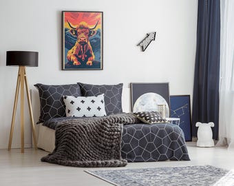 May include: A bedroom with a black and white geometric patterned bedspread and a throw blanket. A framed print of a red and orange highland cow is hanging on the wall above the bed. A black lamp with a wooden tripod stand is in the corner of the room.