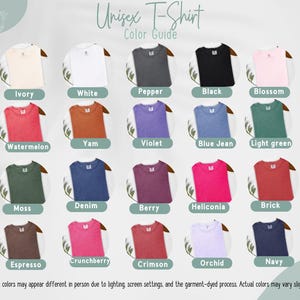 May include: A colour guide for unisex t-shirts, displaying various colours such as ivory, white, black, and navy. The image shows the t-shirts in a grid, with each colour labelled. The text "Unisex T-Shirt Color Guide" is at the top.