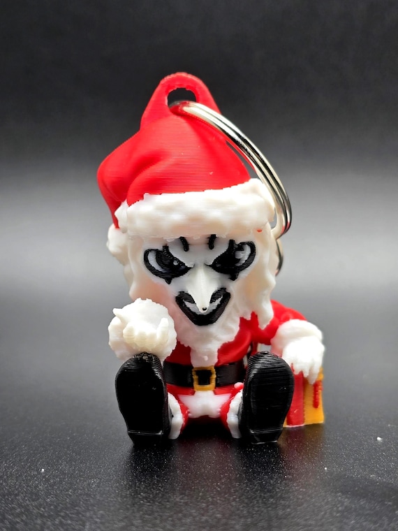Art the clown in Santa suit key chain.