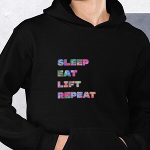 May include: Black hoodie with a colorful graphic that says "SLEEP EAT LIFT REPEAT".