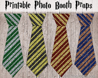 May include: Four printable photo booth props featuring ties with different colored stripes and glitter accents. The ties are green and silver, yellow and black, red and gold, and blue and brown.