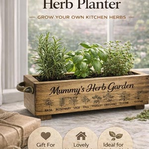 May include: A rectangular wooden herb planter with metal side handles and four small feet. The front is engraved with the text Mummy's Herb Garden and illustrations of herbs labelled Basil, Rosemary, Sage, Dill, Parsley, Oregano, and Thyme.