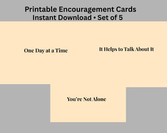May include: A digital image featuring printable encouragement cards. The cards have phrases like "One Day at a Time," "It Helps to Talk About It," and "You're Not Alone." The text is in a simple, readable font.