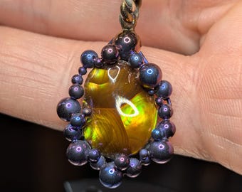 Deer Creek fire agate set in a Titanium and sterling silver pendant