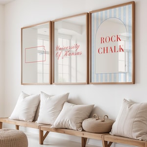 May include: Three framed mirrors with wooden frames hang above a wooden bench with pillows. The mirrors display the text "University Of Kansas", a red outline of Kansas, and the words "ROCK CHALK" on a blue and white striped background.