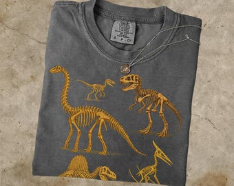 Camiseta vintage de esqueleto de dinosaurio, diseño de dinosaurio fósil, colores retro cómodos C1717