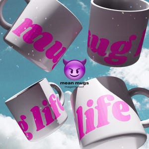 May include: Four white ceramic mugs with pink text that reads "my", "mug", and "life". A purple devil emoji is in the center. The text "mean mugs" and "magentafoof" is below the emoji. The background is a blue sky with clouds.