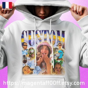 May include: White hoodie with a graphic design featuring the word "CUSTOM" and the text "Too Texas". The design includes multiple images of people. The Etsy shop URL is visible at the bottom.