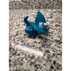 May include: A rustic wooden sign with the text "Welcome to our home" in white lettering. The sign features a distressed finish and a simple, inviting design, perfect for a front porch or entryway.