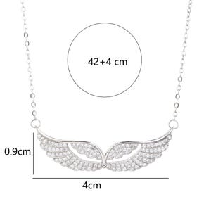 May include: A silver-toned necklace featuring a wing-shaped pendant adorned with small, sparkling stones. The pendant is 4 cm wide and 0.9 cm high. The chain is 42+4 cm long. The necklace is designed to be worn around the neck.