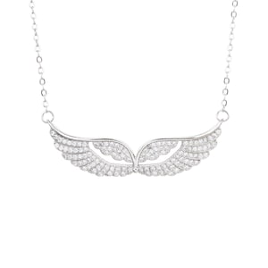 May include: A silver-toned necklace featuring a pendant shaped like stylized wings. The wings are encrusted with small, sparkling crystals, creating a shimmering effect. The necklace hangs on a delicate chain.