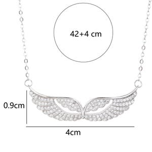 May include: Silver-toned necklace featuring a pendant shaped like stylized wings, encrusted with small, clear gemstones. The wingspan is 4 cm (1.57 inches) wide, and the chain is 42 cm (16.53 inches) long, plus 4 cm (1.57 inches) of extension.