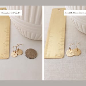 May include: Two pairs of gold-colored disc earrings with hammered texture, displayed with a ruler and a dime for size comparison. The smaller earrings are 10mm (3/8" or .4") and the larger ones are 13mm (1/2" or .5").
