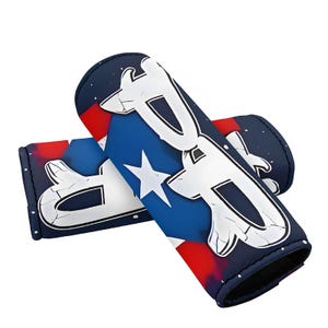 May include: A pair of blue and red handlebar grips with a white star and a white graphic design. The grips have a textured surface.
