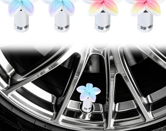 May include: Four tire valve stem caps featuring five-petaled flower designs in blue-to-white and pink-to-yellow gradients, attached to silver cylindrical bases. One blue-and-white flower cap is shown installed on a chrome car wheel rim.
