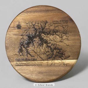 May include: A round wooden serving board featuring a laser-engraved map of Dale Hollow Lake. The design includes a compass rose, lake area and depth statistics, and the names of the surrounding counties in Tennessee and Kentucky.