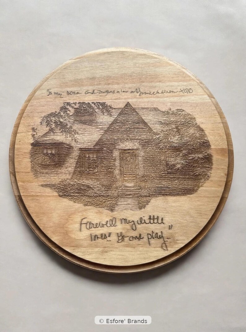 May include: A round wooden plaque featuring a laser-engraved illustration of a house surrounded by trees. The text at the top reads "To my sons and daughters in law and grandchildren XOXO" and the bottom text reads "Farewell my little ones! Go and play..."