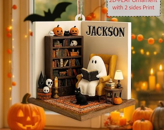 May include: A Halloween-themed ornament featuring a ghost reading in a cozy armchair next to a bookshelf. The ornament includes a black cat, pumpkins, and the name "JACKSON". The text on the ornament reads "NOTE: Customized 2D-FLAT Ornament with 2 sides Print".